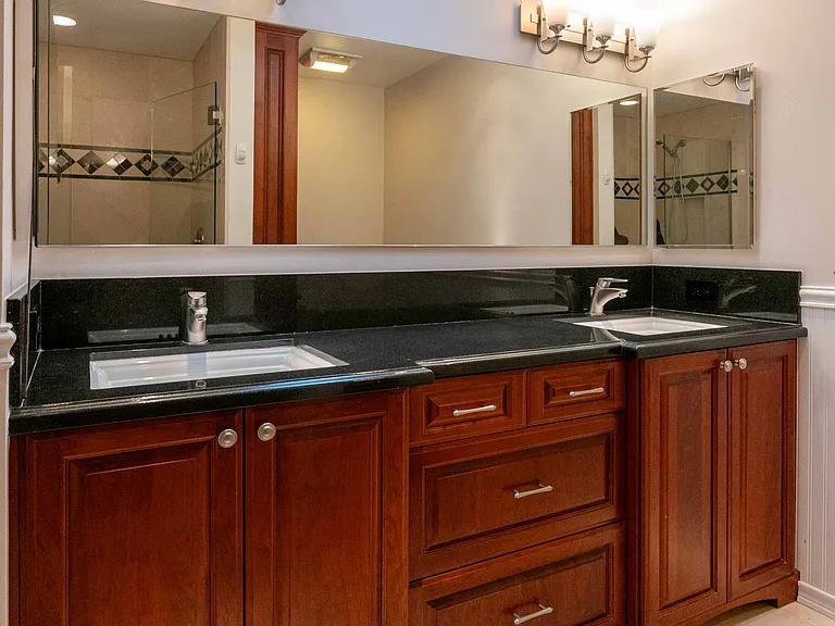 Hall bathroom with double vanity.