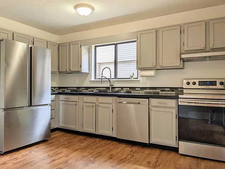 Eat-in kitchen with stainless steel appliances and plenty of cabinet space.