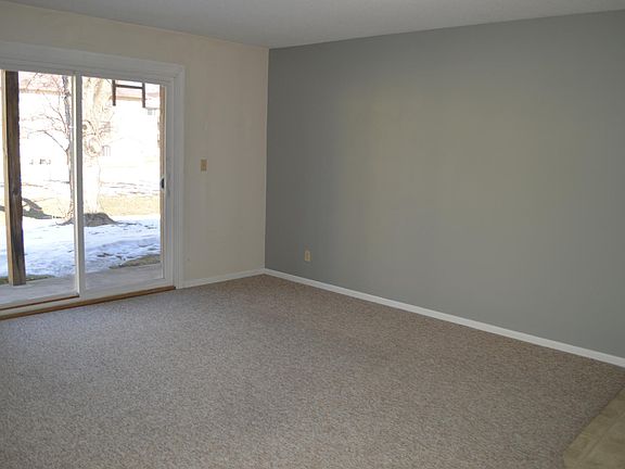 Living room. Sliding glass door to cement patio area.