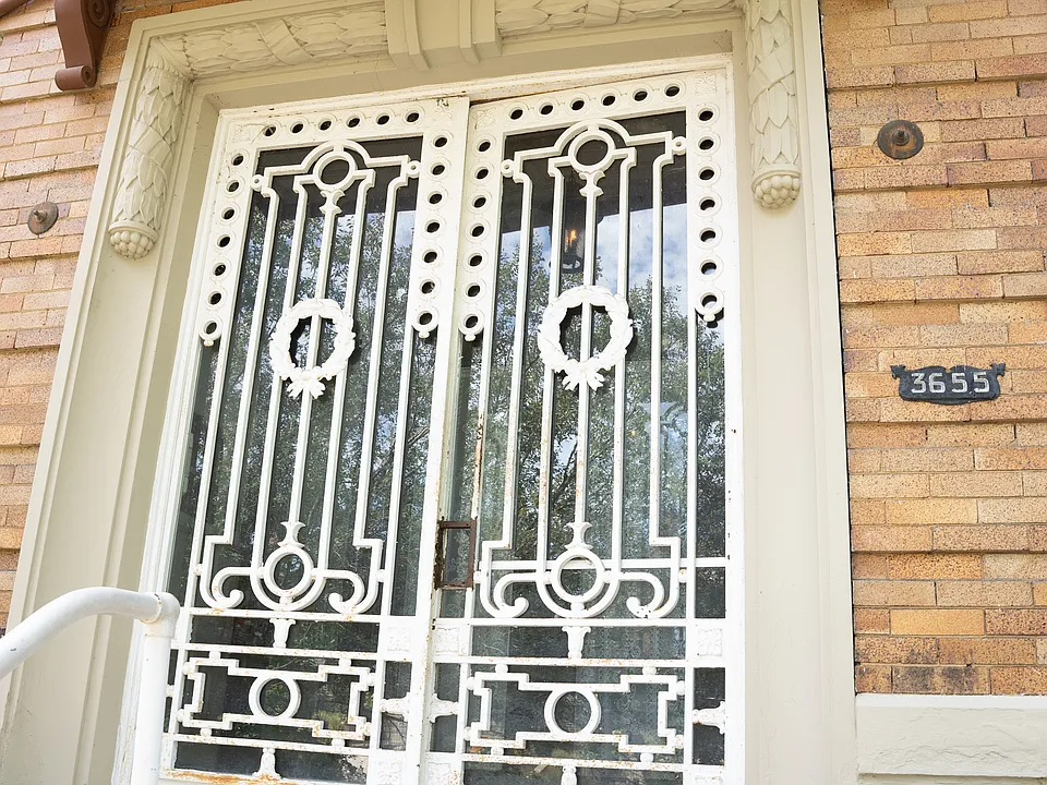 2 ornate iron doors make a great first impression when friends come to visit.