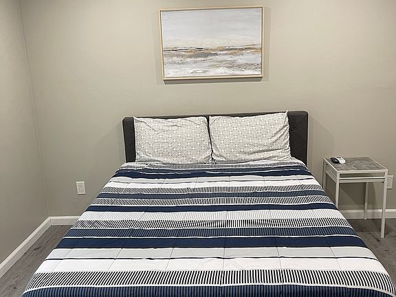 Queen size bed with fan and closet