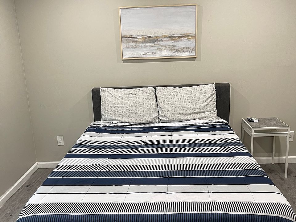 Queen size bed with fan and closet