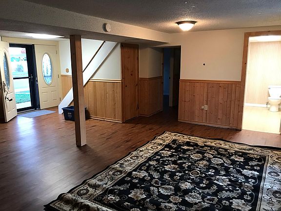 1st floor living room. 1/2 bath on right. 1st floor bedroom/office down hall.