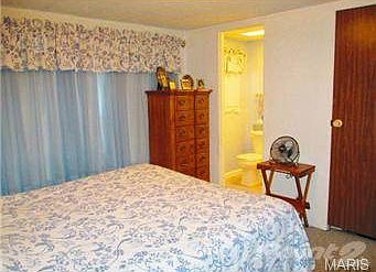 View of master bedroom with 1/2 bath.