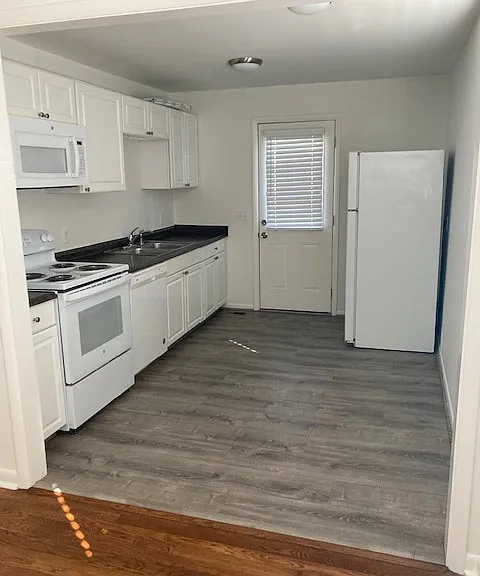 Kitchen with space for table and chairs under front window