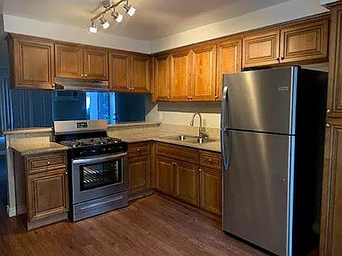 PREVIOUSLY REMODELED KITCHEN (BROWN CABINETS)