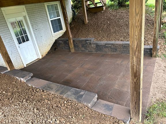 Stepping stones leading from the driveway around the garage to your private entrance