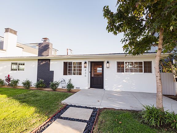 Spacious front yard with patio/side access to 2nd master