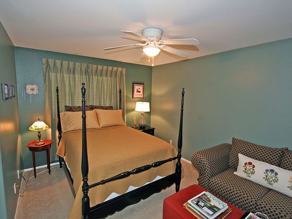 Guest bedroom with sofa and reading nook