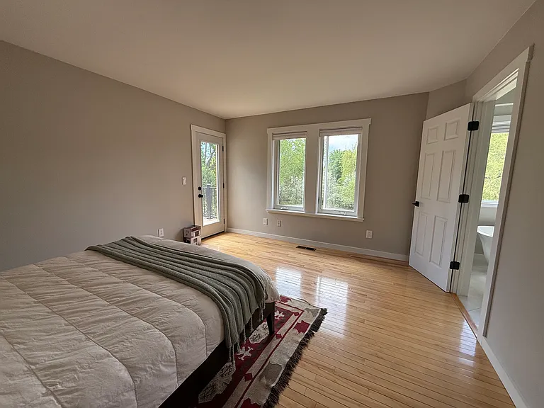 Primary bedroom, door to upper deck