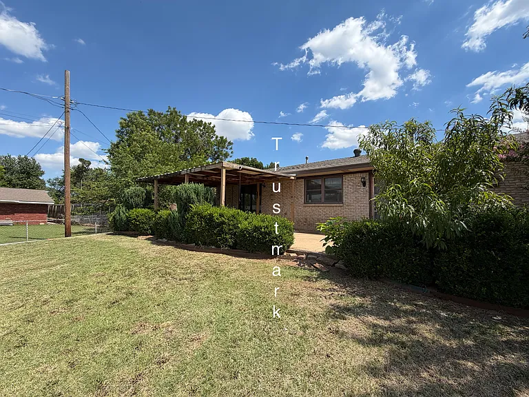 Back of house with covered patio