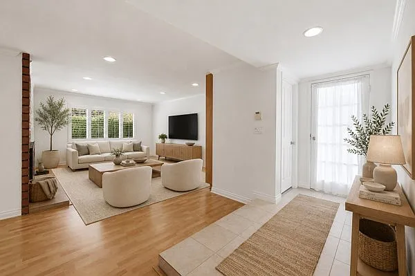 Front entry. Living room/family room. Dual-sided fireplace, bookcase.