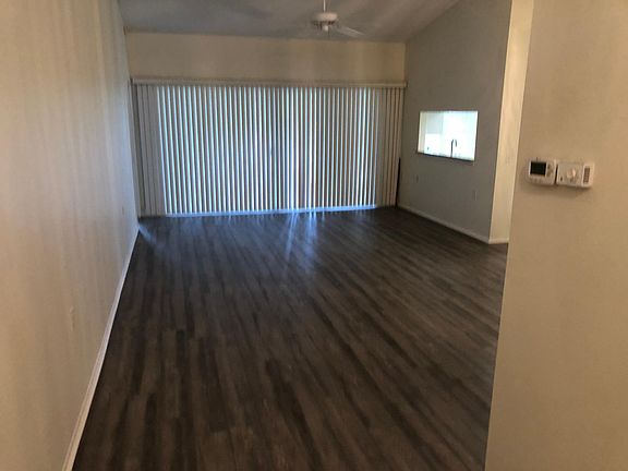 Showing Living Room From ENTRY also Shows Kitchen Bar