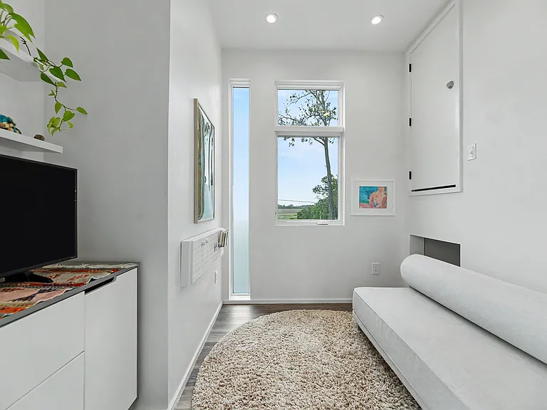 Main level flex space with Smart TV and sofa bed