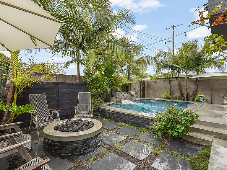 Backyard features built-in gas firepit