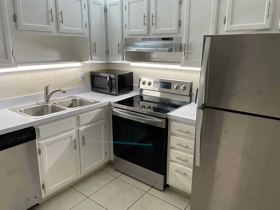 Refreshed and painted kitchen with brand new stainless appliances. Newly sanded and painted cabinets with new hardware.