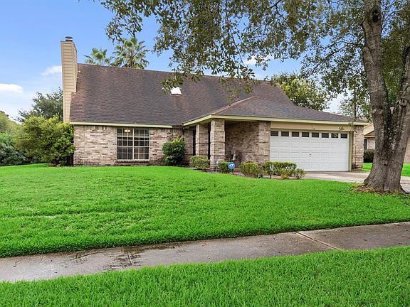 Mature landscape and covered front porch provide great curb appeal