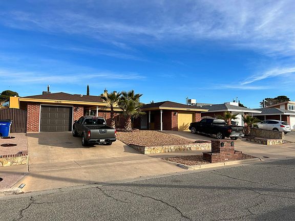 another front of duplex, both sides have private garage and driveway