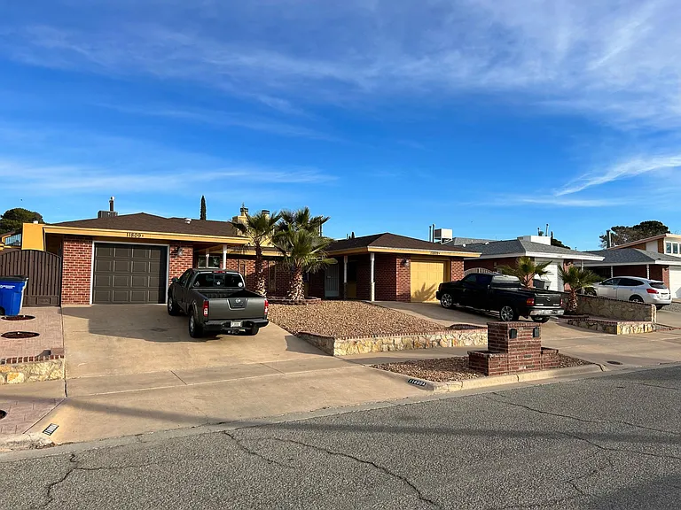 another front of duplex, both sides have private garage and driveway