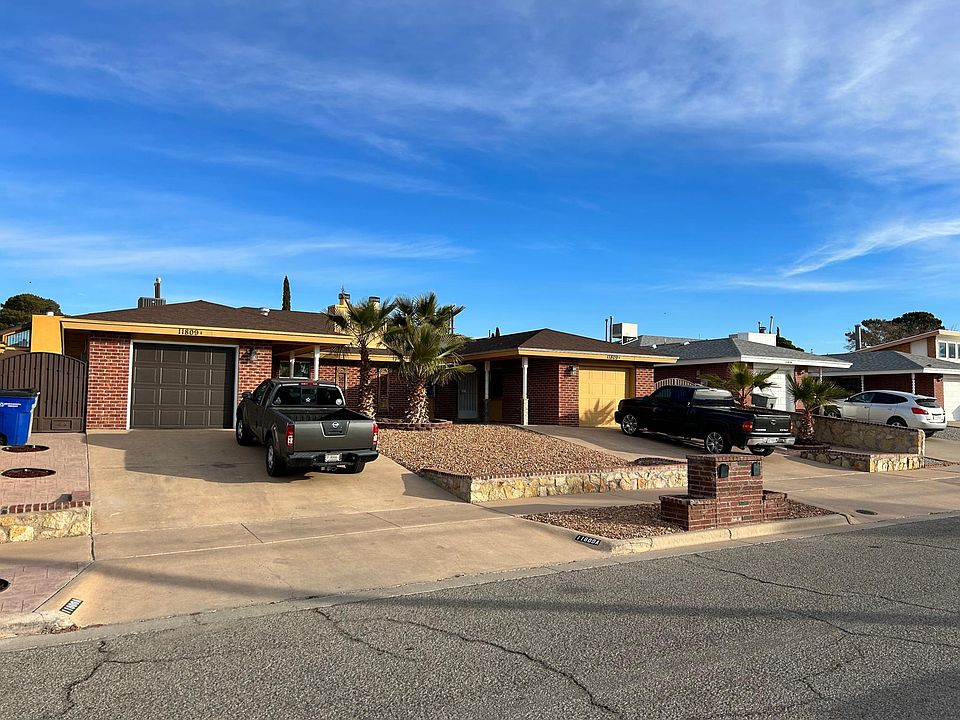 another front of duplex, both sides have private garage and driveway