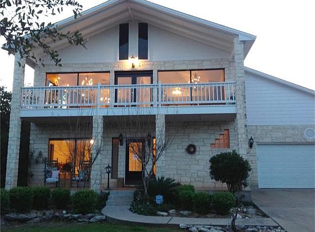 Front exterior, covered balcony, covered porch, landscaping