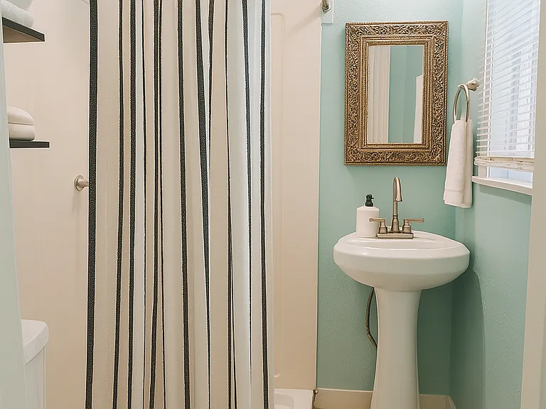 Bathroom with shower. Window for natural light and ventilation.