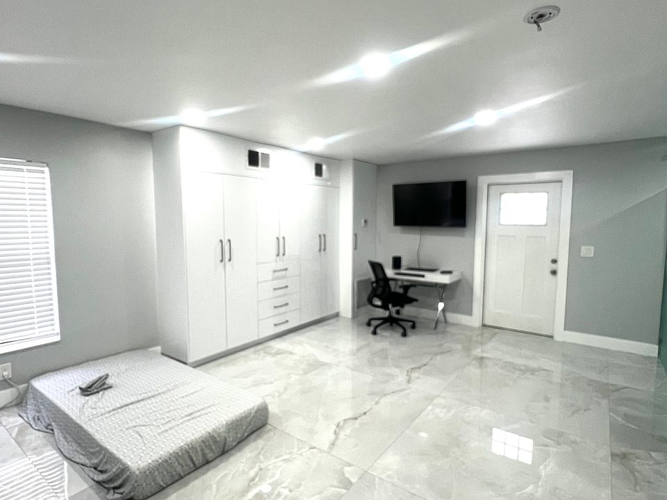 View of custom closet in separate apartment or second master bedroom. Apartment includes separate entrance as well.