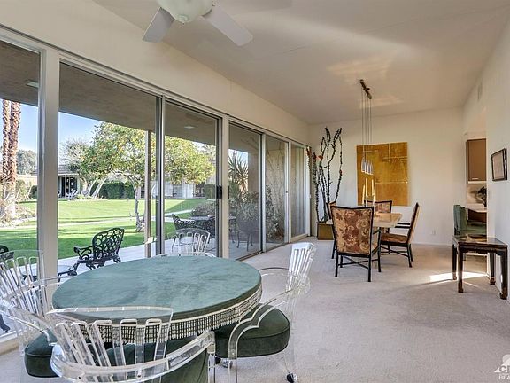 On the other side of the main living area, there is yet another wall of sliding doors, gracing you with a spectacular view of the greenbelt just off the back patio.