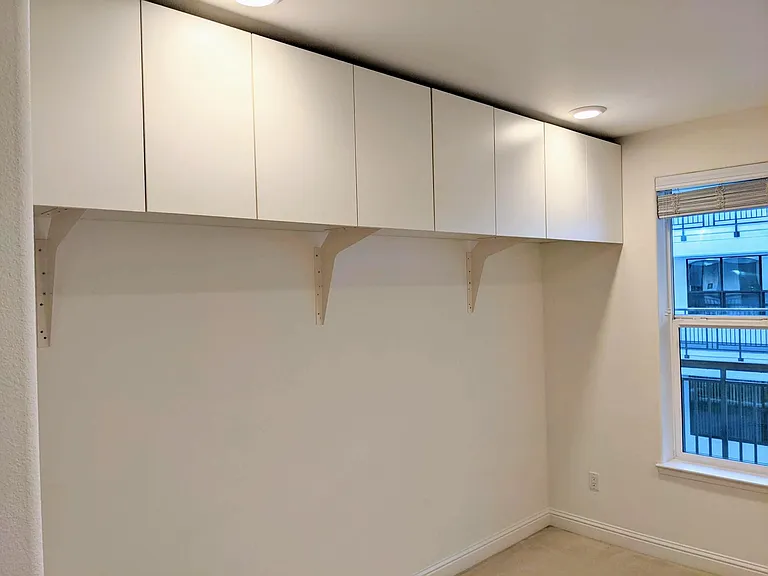 Bedroom 3 with deep storage cabinets