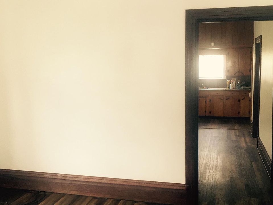 Living room, dining room and kitchen. New flooring