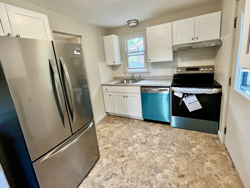 Kitchen, all new everything. You can see the blue protection film still on some of the appliances.