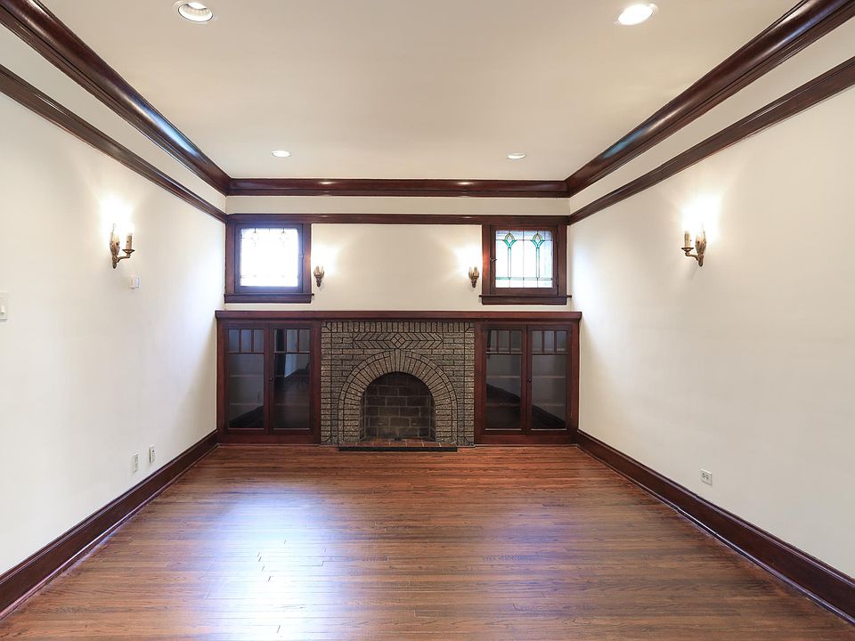 Living room with down lights and original art deco sconces