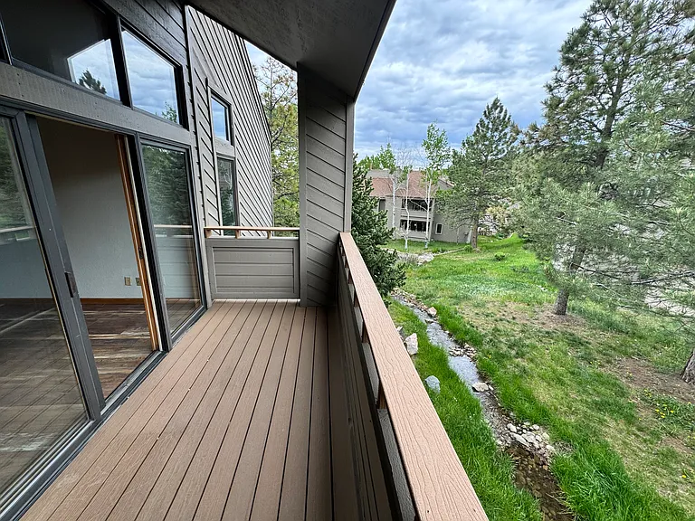 Private deck overlooking trees and natural open space _ ideal for morning coffee, fresh air, and quiet evenings in Genesee.