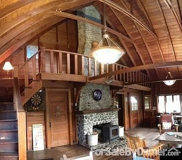Great Room w/ Beach Rock Fireplace
						:
						Stairs lead to balcony mezzanine, and access to 2 upstairs bedrooms.