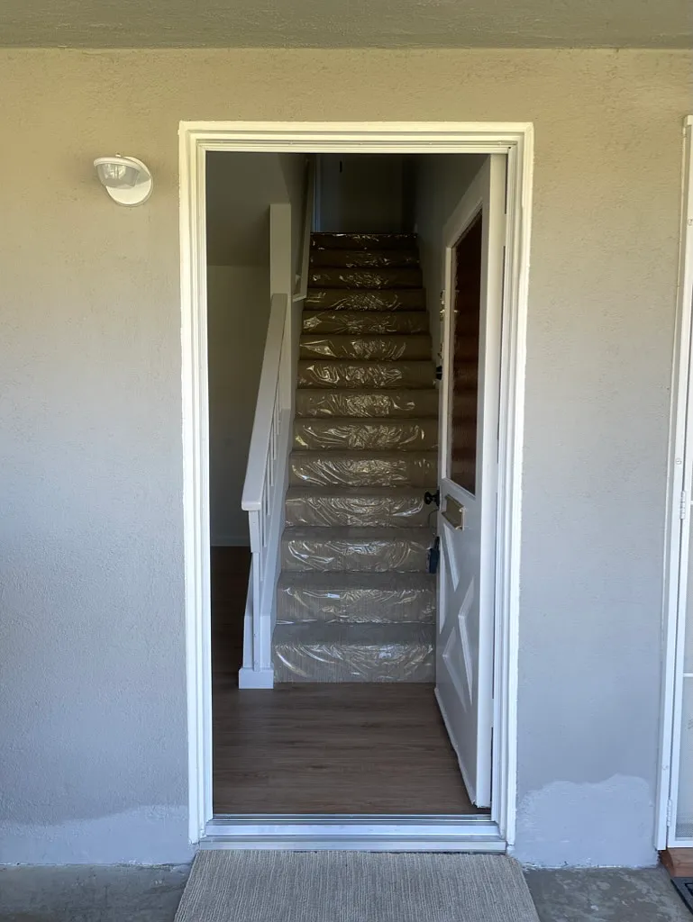 Living room to left, stairs lead to two bedrooms and 1 full bath - 16631 Tunstall Ln #3