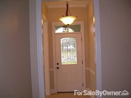 Foyer : Beveled glass door. All exterior doors are steel construction