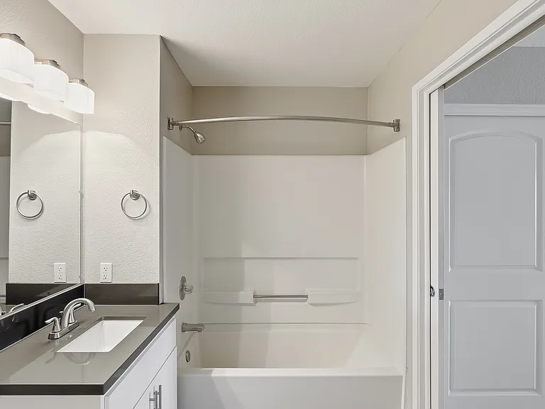Start and end your day in a bright, modern bathroom designed to match the clean lines and elevated finishes.