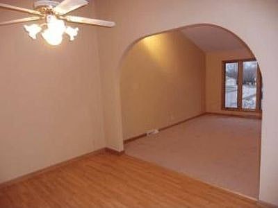 formal living room has cathedral ceilings, track lighting, f