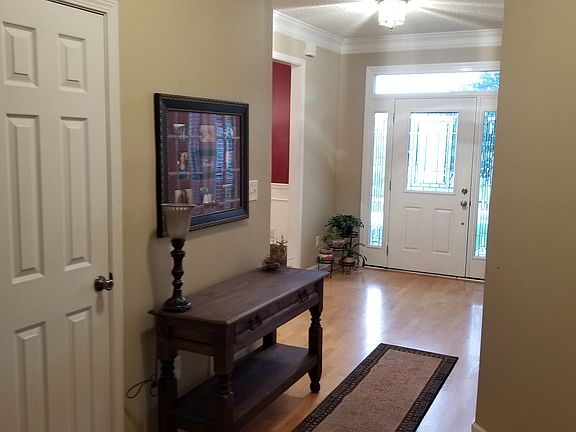 Foyer hallway and half bath door