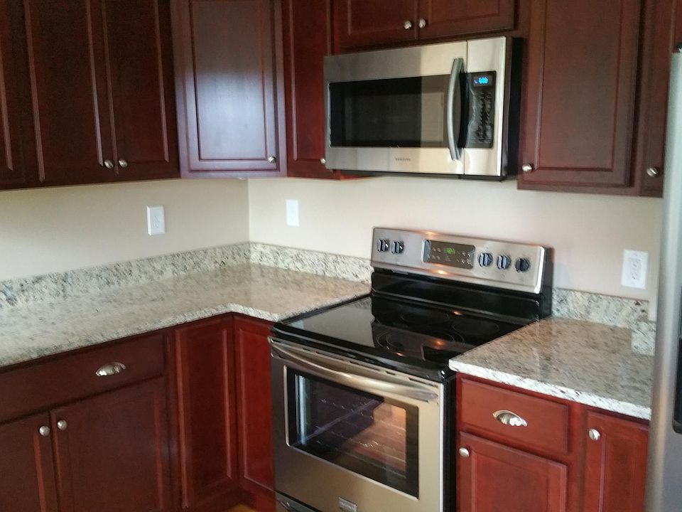 Kitchen with granite countertops and stainless steel applian