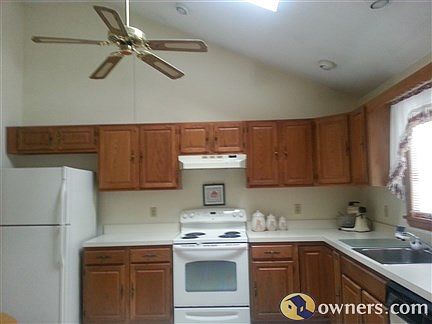 kitchen showing skylight and ceiling fan