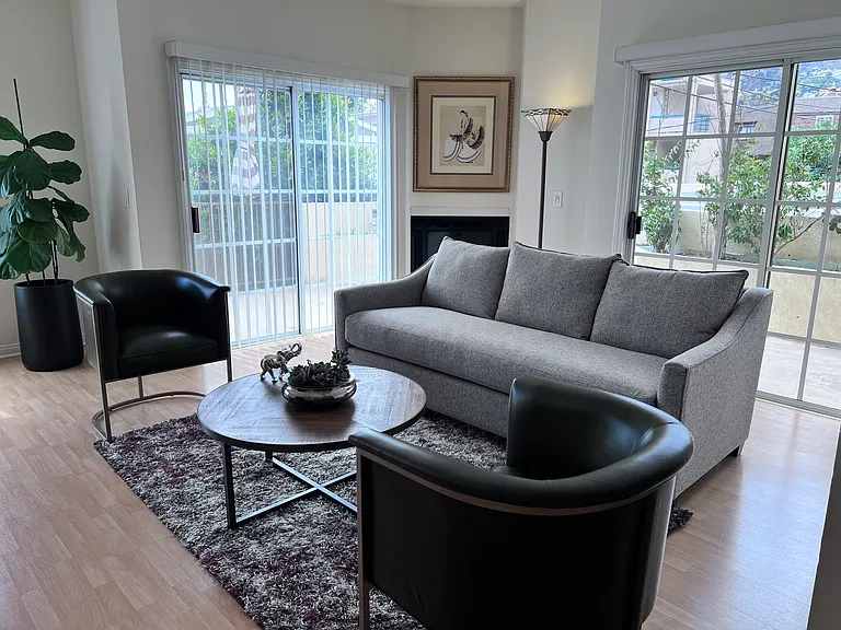 Mountain view and 2 chair and table patio area.
