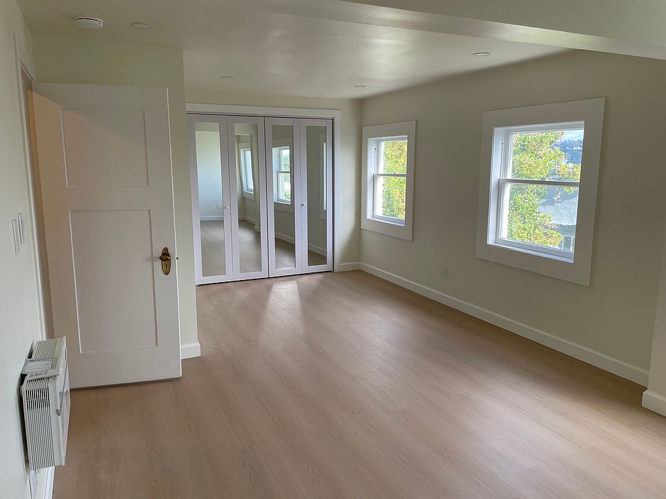 From the bed portion of the bedroom, large space with mirrored bifold closet doors and a 1500 watt forced air electric heater in the room.