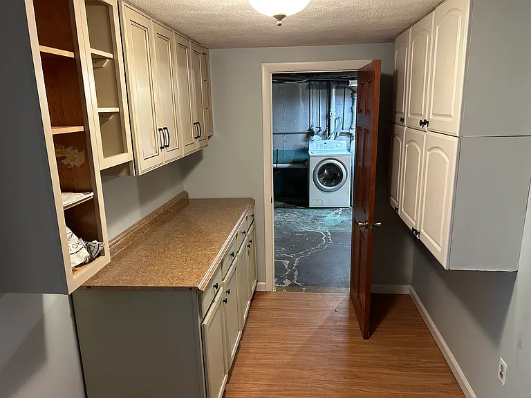 Additional kitchen storage space and laundry.