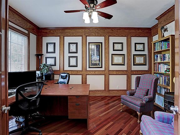 The study is large enough for two full size desks and work stations and still plenty of room. The study features French doors, ceiling fan with lights, Brazilian solid cherry hardwood floors, unique wood panel walls and even has a door that opens to 