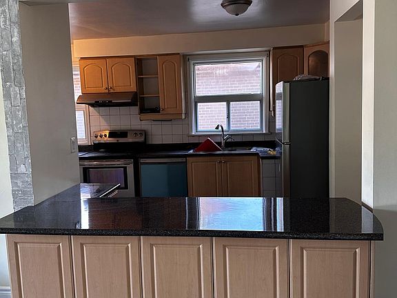 open conept kitchen with dishwasher, fridge electric oven