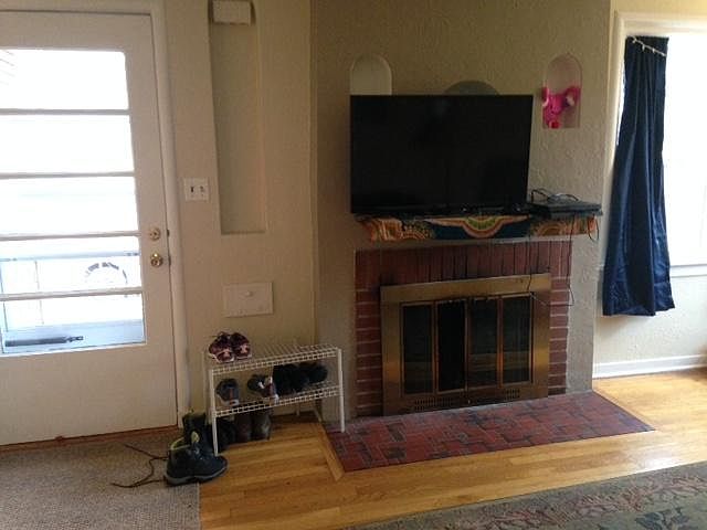 Front door and fireplace in living room