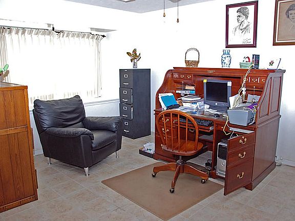 Versatile floor plan. This room is off entry way and is being used as study.