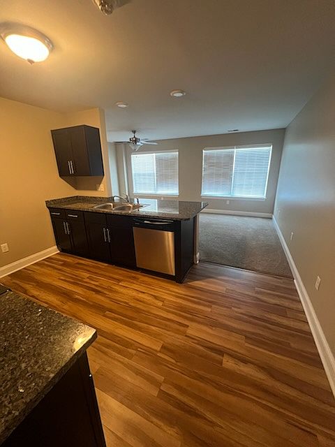 Kitchen open to living room with counter overhang for bar stools