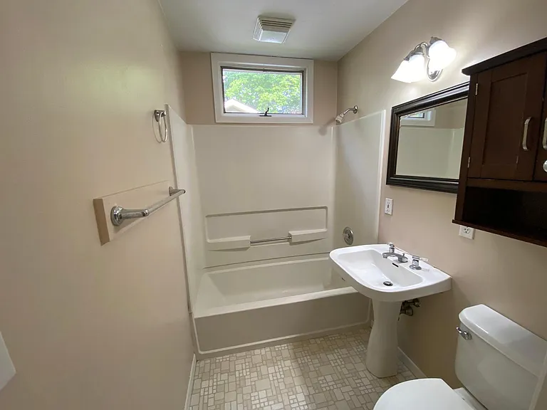 East wing bathroom photo will be updated to the new walk in shower, vanity and toilet.